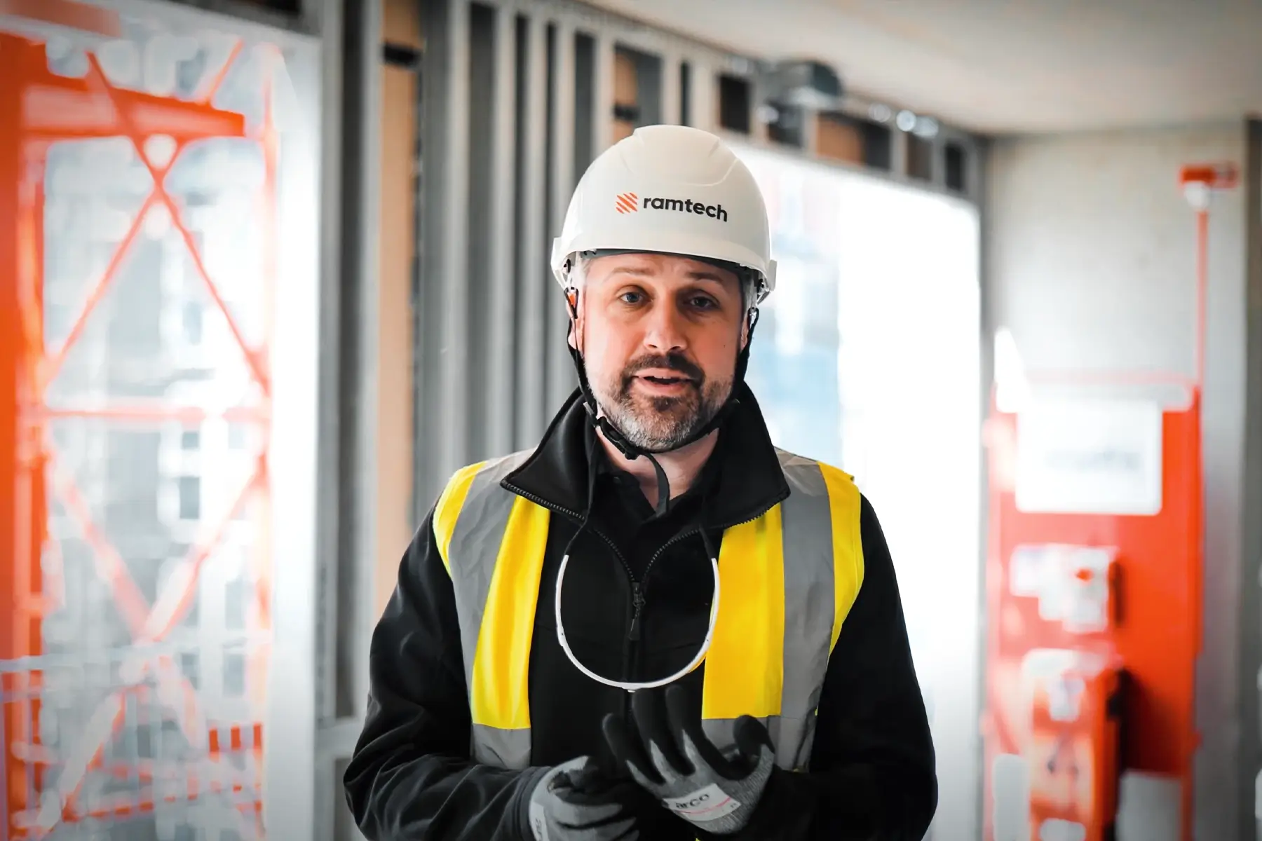 Ramtech representative in hi-vis and branded helmet on the Kirkstall Road construction site in Leeds