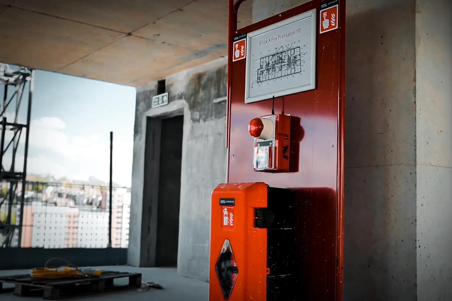 Ramtech WES wireless fire alarm unit and extinguisher at a fire point inside Block A, Kirkstall Road