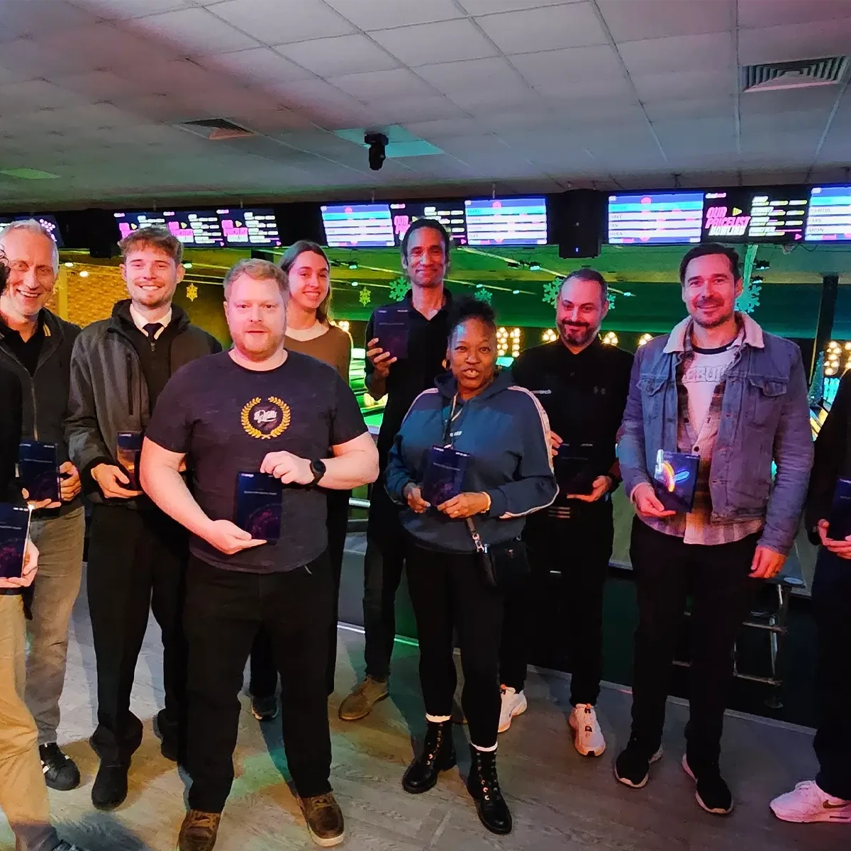 Ramtech People & Culture team holding awards during company celebration event
