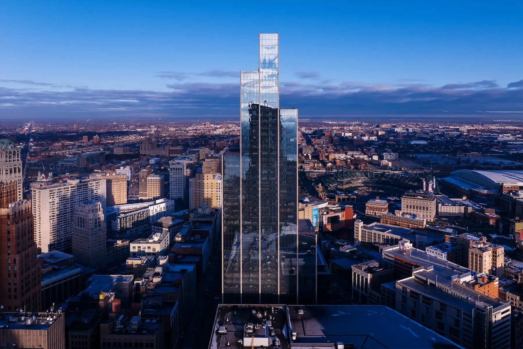 The completed glass facade of the tower highlighting Hudsons Detroit construction safety at height.
