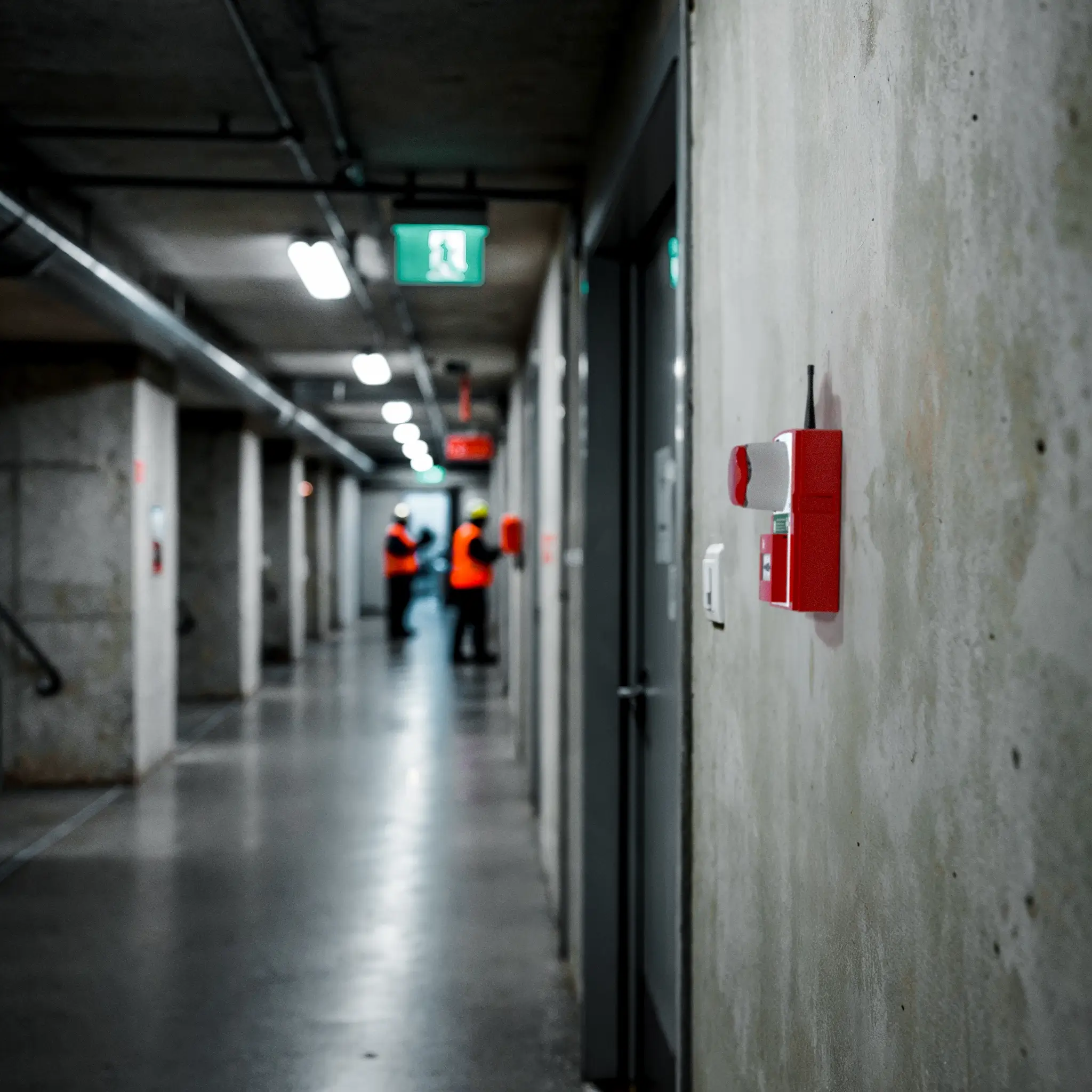 WES3 manual call point in industrial building corridor.